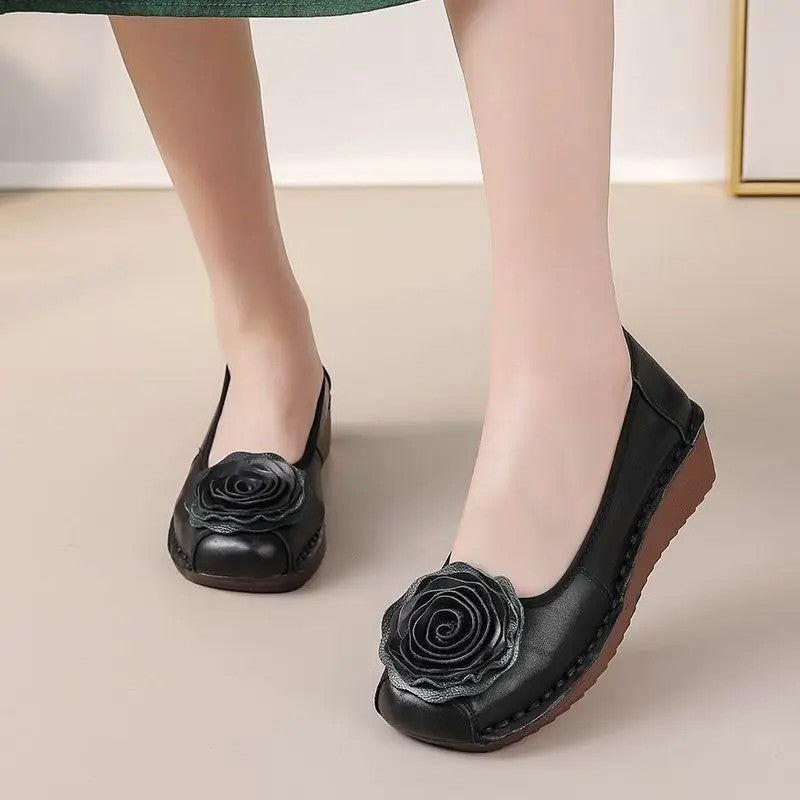 Detailed view of women's floral appliqué comfort loafers, perfect for casual elegance.