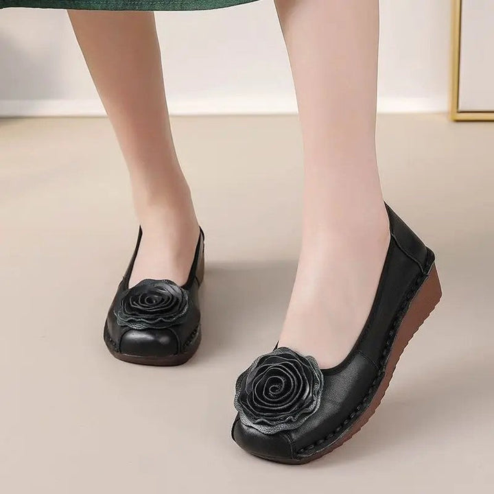 Detailed view of women's floral appliqué comfort loafers, perfect for casual elegance.