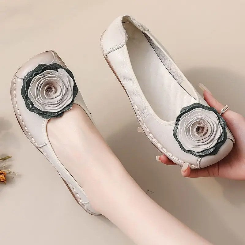 Fashionable women's loafers with elegant floral appliqué for ultimate slip-on comfort.