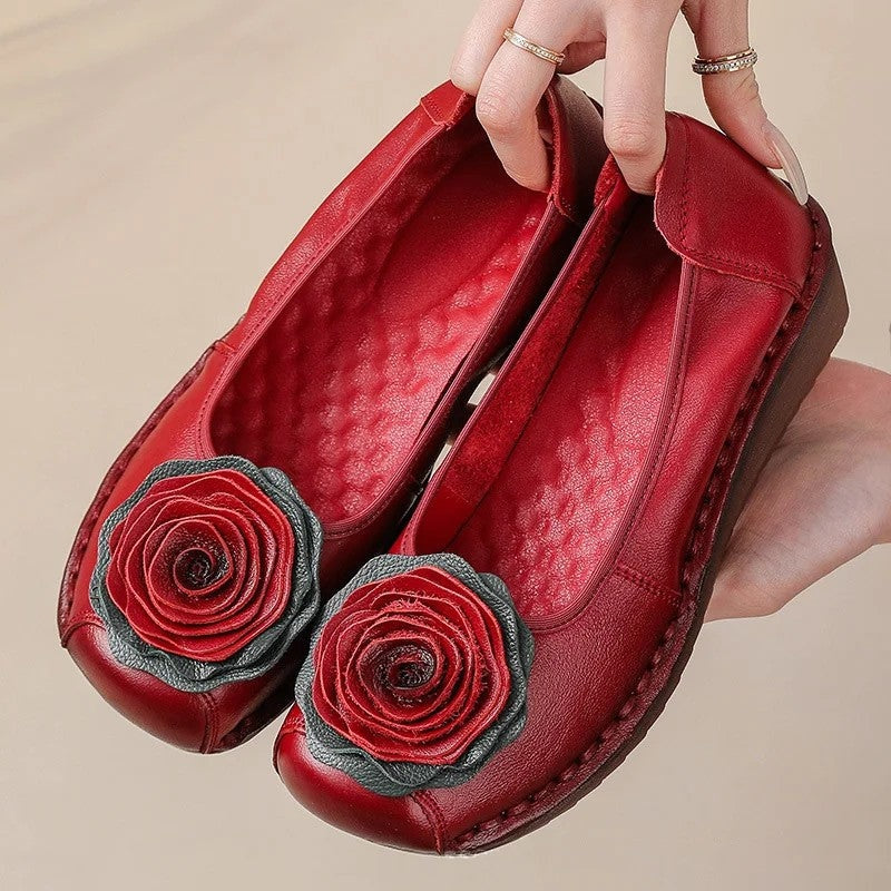 Delicate floral appliqué on comfortable women's slip-on loafers, great for spring.