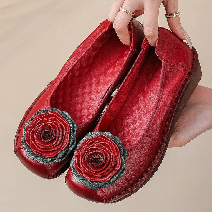 Delicate floral appliqué on comfortable women's slip-on loafers, great for spring.