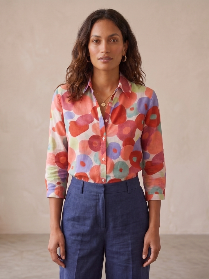 Relaxed fit women's floral blouse, button-down with roll-tab sleeves. Stylish spring & summer casual top.