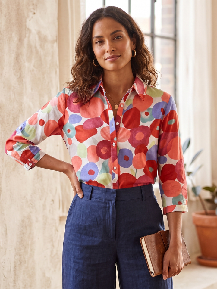 Comfortable women's floral button-down blouse with versatile roll-tab sleeves & relaxed fit for daily fashion.