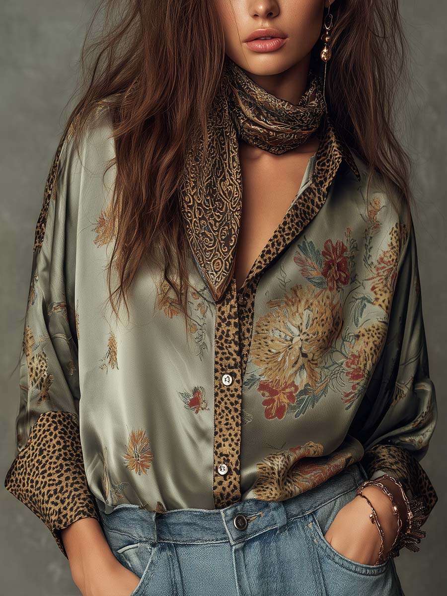 Women's floral button-down shirt with chic leopard print trim and long sleeves.