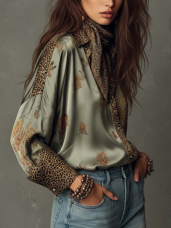Stylish women's floral blouse, a long-sleeve button-down top featuring leopard accent trim.