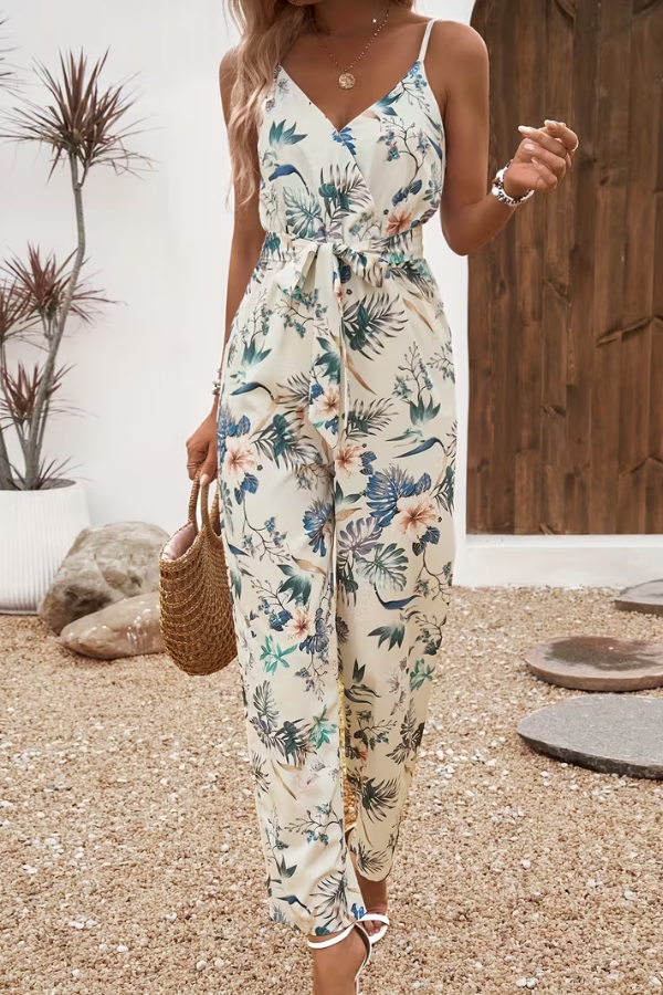 Women's floral cami jumpsuit with tie waist, perfect for summer vacations & casual elegance.