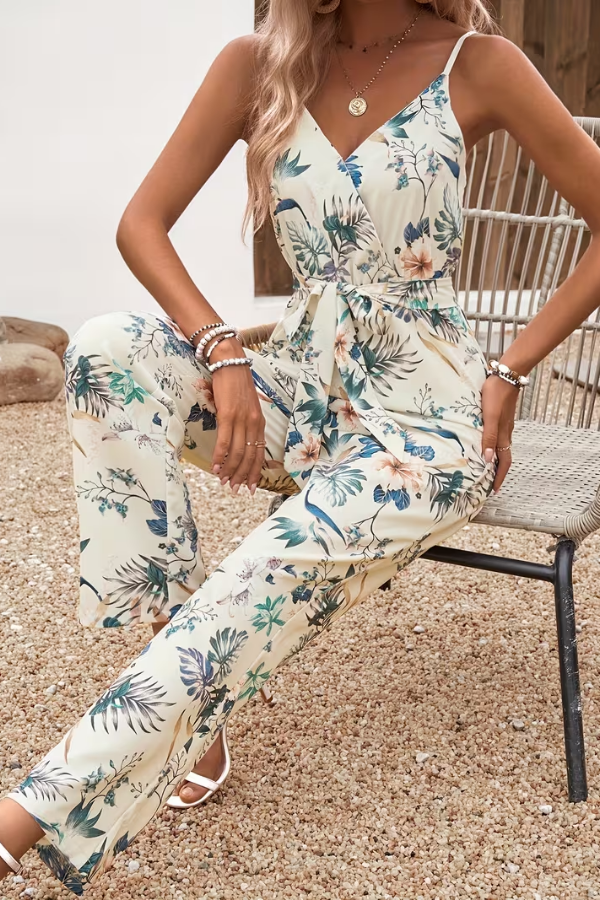 Elegant women's sleeveless floral jumpsuit with a chic tie waist, ideal for spring & summer fashion.