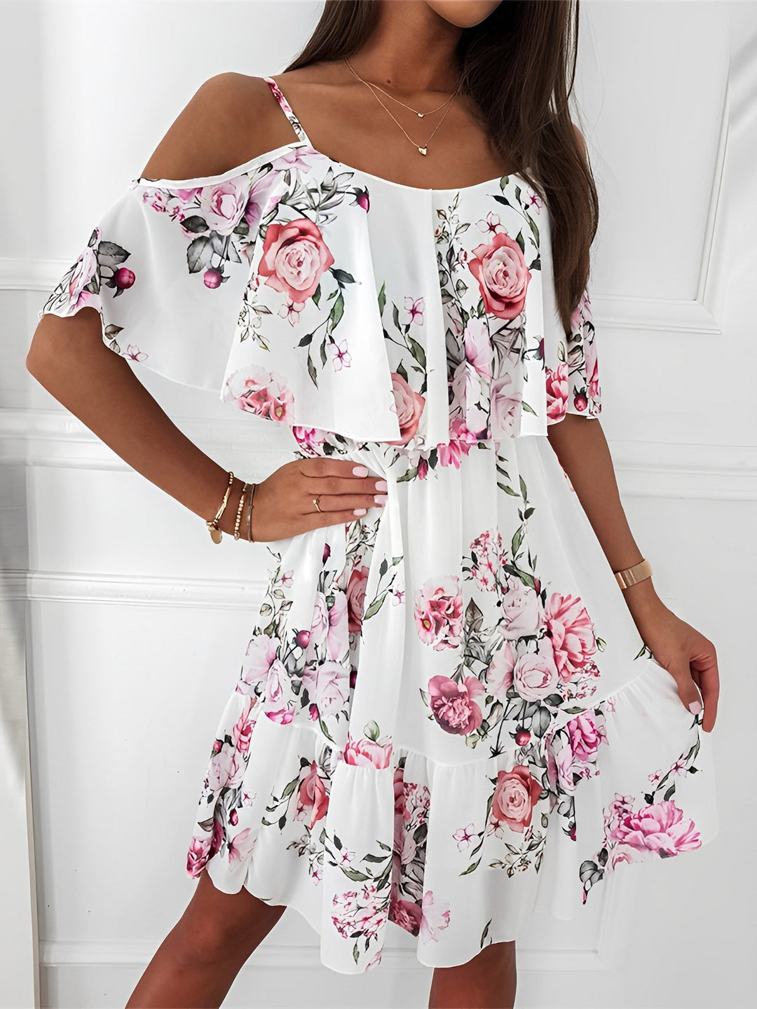 Women's floral cold shoulder mini dress with flowy ruffle style. Perfect for summer, vacation & garden parties.