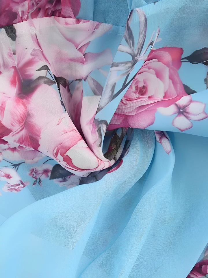 Fashionable women's floral cold shoulder mini dress. Flowy ruffle style, perfect for elegant casual looks.