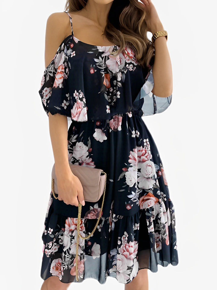 Women's summer floral cold shoulder mini dress. Flowy ruffled design, perfect for vacation or garden party.