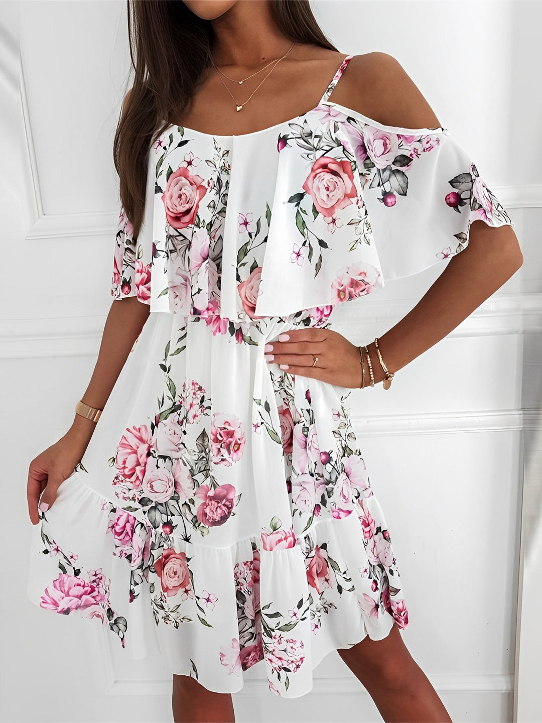 Elegant women's floral print mini dress with cold shoulder cut & flowy ruffle details. Great for casual wear.