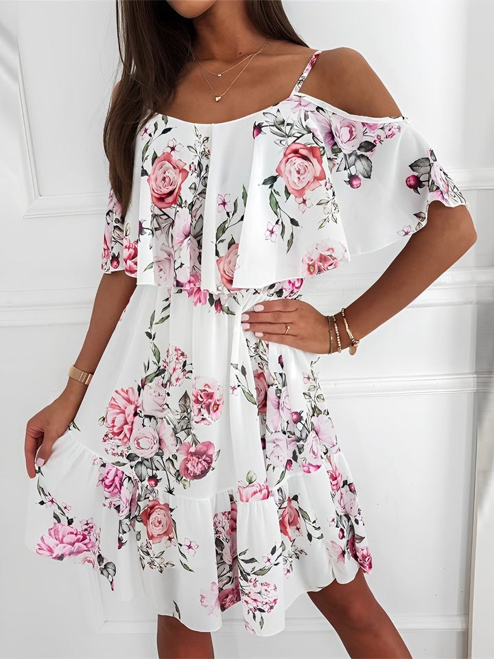 Elegant women's floral print mini dress with cold shoulder cut & flowy ruffle details. Great for casual wear.