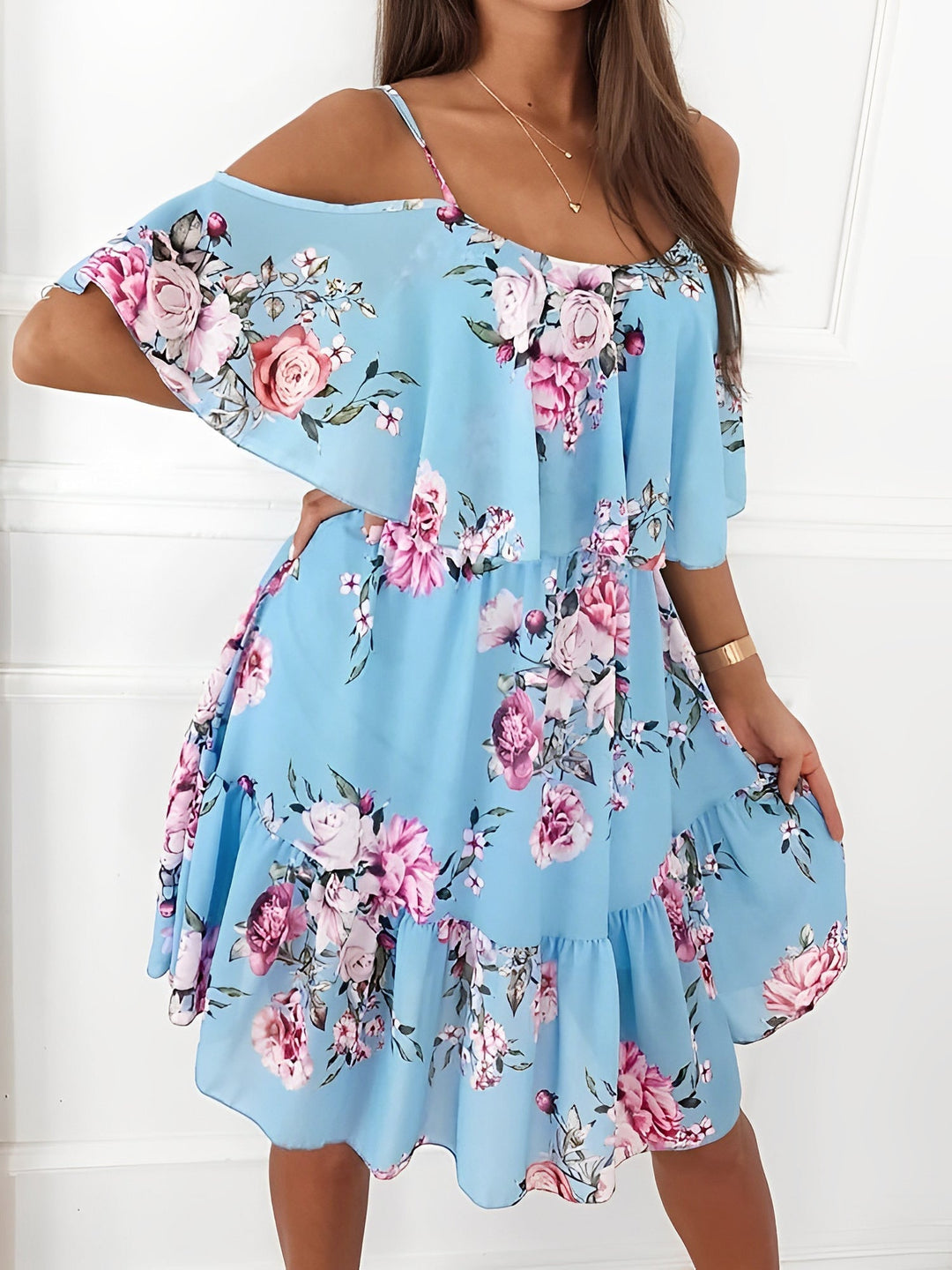 Women's flowy ruffle floral mini dress. Cold shoulder design, comfortable and stylish for summer fashion.