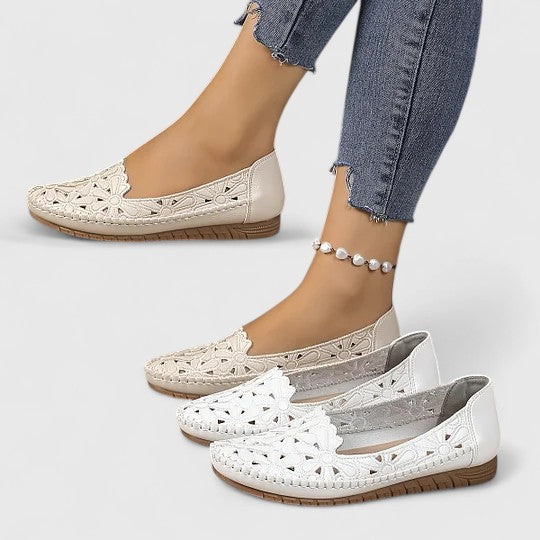 Women's floral cutout slip-on ballet flats with comfortable round toe for everyday wear.