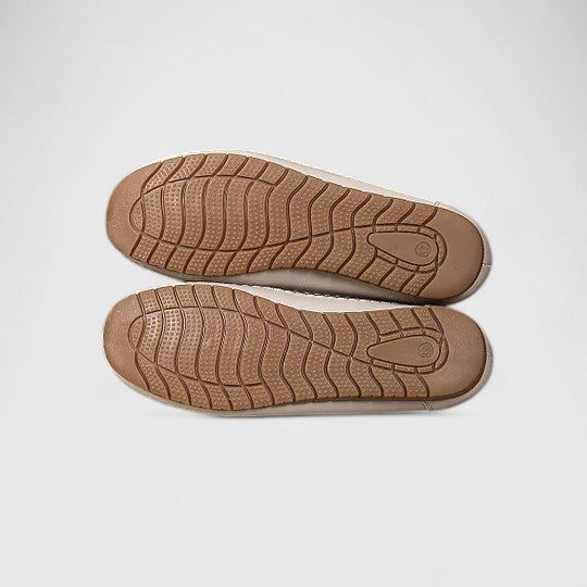 Everyday women's ballet flats, comfortable slip-on style, delicate floral cutouts and scalloped trim.