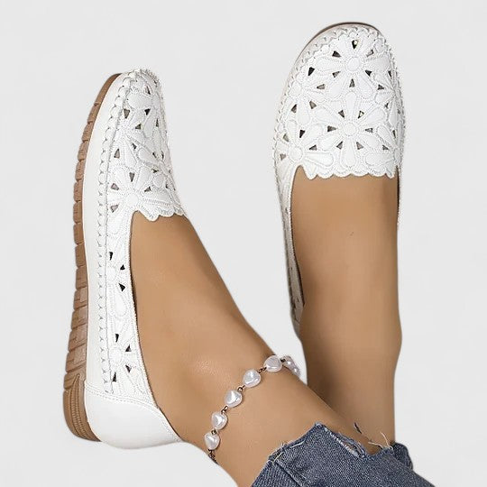 White women's floral cutout ballet flats, slip-on comfort, perfect for casual everyday wear.