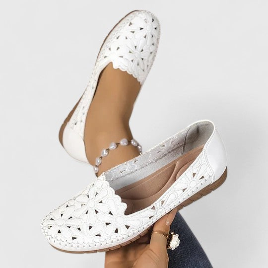 Stylish women's floral cutout ballet flats, round toe design, comfortable slip-on for casual outings.