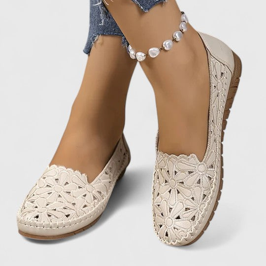 Women's comfortable slip-on ballet flats with floral cutouts for everyday casual elegance.