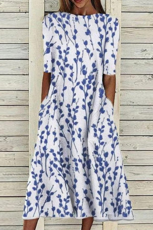 Women's floral half-sleeve midi dress with crew neck for casual summer & spring fashion; relaxed fit.