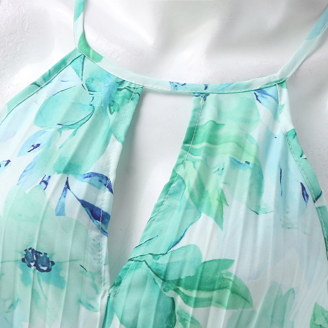 Full-length women's floral pleated maxi dress, elegant halter neck, perfect for summer occasion wear.