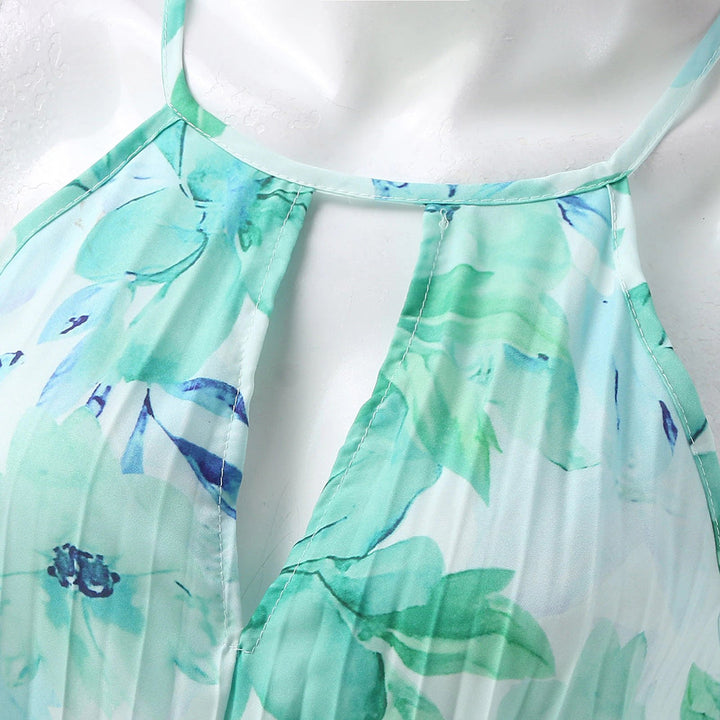 Full-length women's floral pleated maxi dress, elegant halter neck, perfect for summer occasion wear.