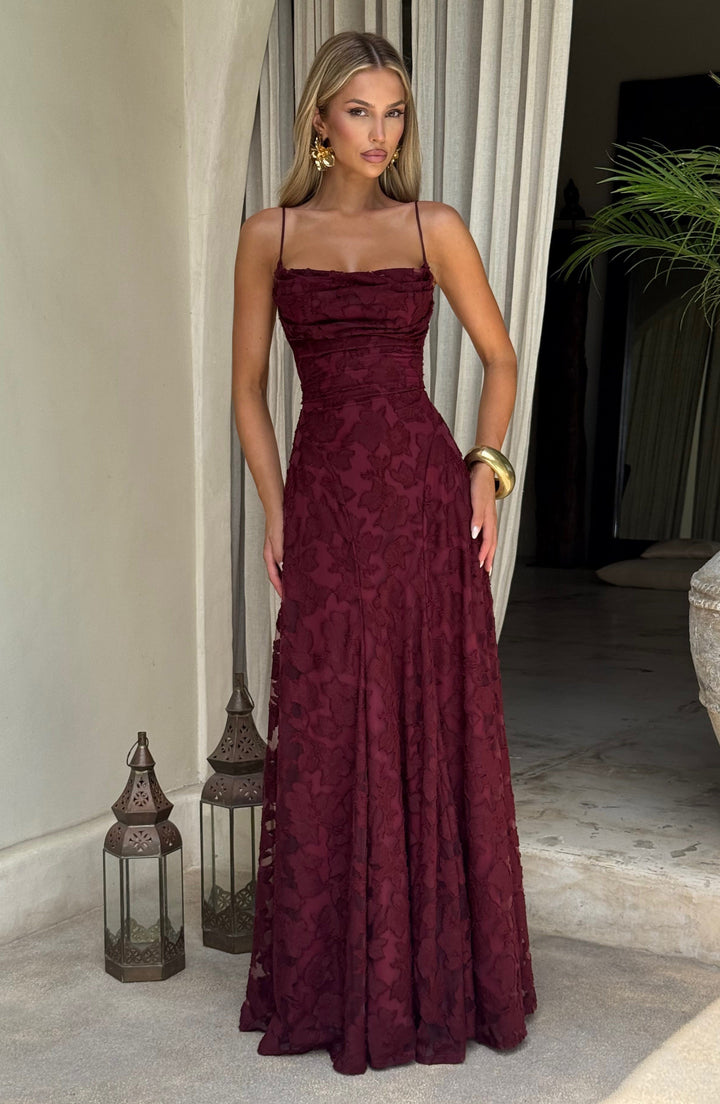 Women's fashion floral maxi dress, sleeveless, with a flattering draped neckline & lace-up back.