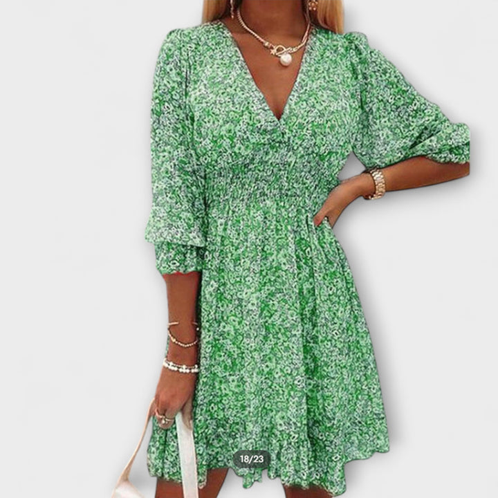 Elegant women's A-line floral midi dress with puff sleeves, ideal for brunch or summer casual wear.