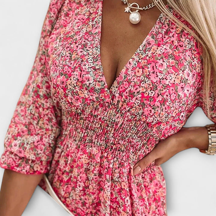 Chic women's floral A-line dress with puff sleeves, a feminine choice for summer casual elegance.