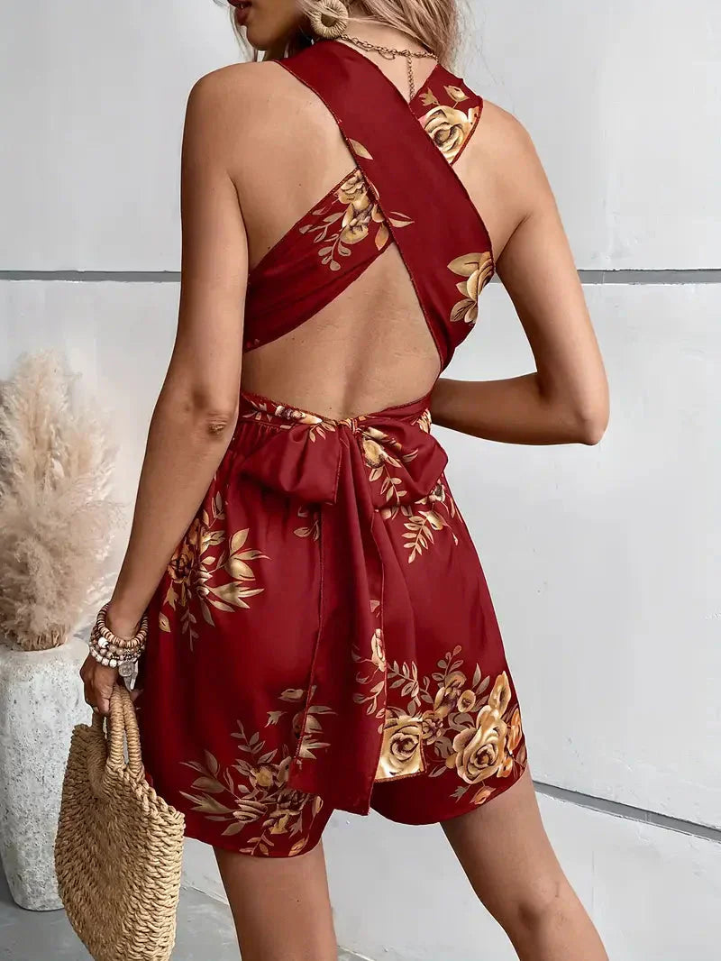 Elegant floral print mini dress for women, a comfortable romper style with an alluring open back.