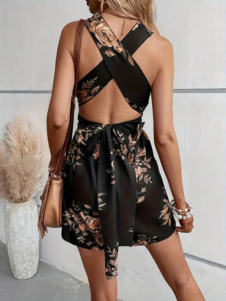 Party-ready women's floral mini dress with an eye-catching open-back design. Perfect for summer.