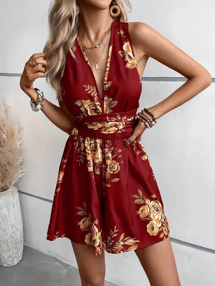 Stylish women's open-back floral romper dress, a comfortable and feminine summer party outfit.