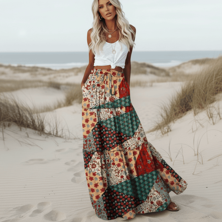 Flowy women's patchwork maxi skirt with vibrant floral print, perfect for casual summer wear & beach vacation.