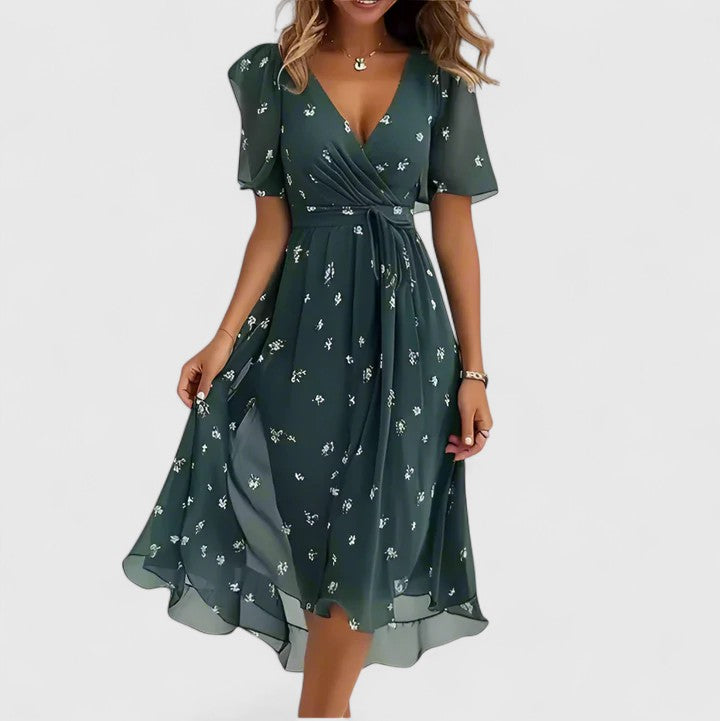 Women's floral plunge V-neck midi dress with flutter sleeves. Ideal elegant dress for spring and summer parties.