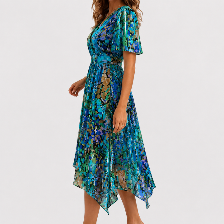Women's floral high-low midi dress, featuring a flattering plunge V-neck and delicate flutter sleeves. Great for summer parties.