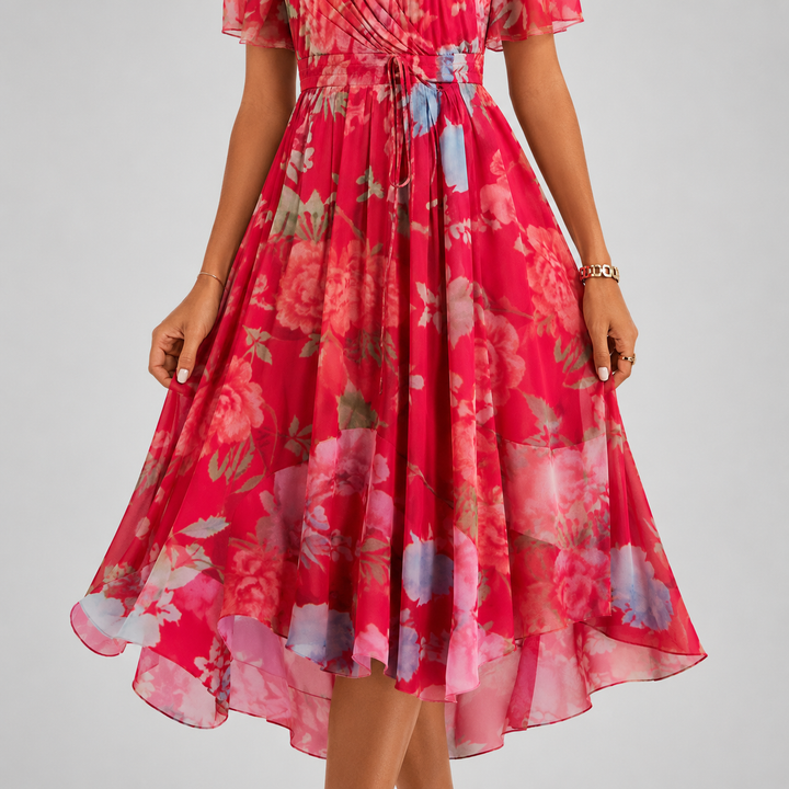 Chic floral high-low midi dress for women, boasting a plunging V-neckline & airy flutter sleeves. Perfect party wear.
