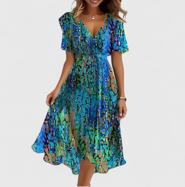 Flowy women's floral midi dress with a plunge V-neck & flutter sleeves, creating an elegant silhouette for spring.