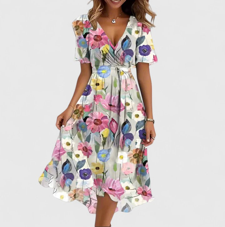 Asymmetrical women's floral midi dress with a bold plunge V-neck and delicate flutter sleeves. Flowy and elegant.