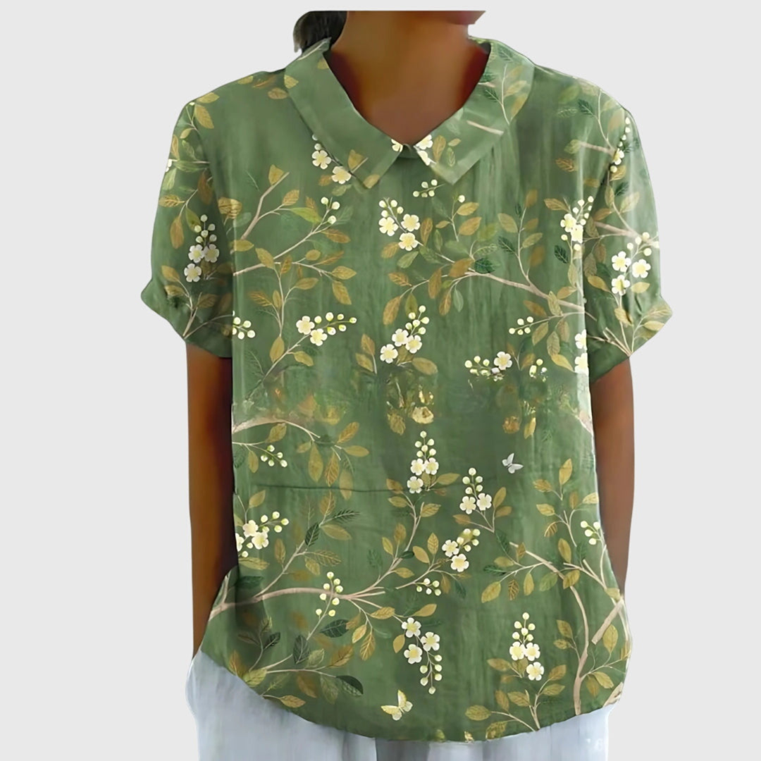 Lightweight easy-care women's floral print blouse with collar, short sleeves, perfect for travel or warm weather.