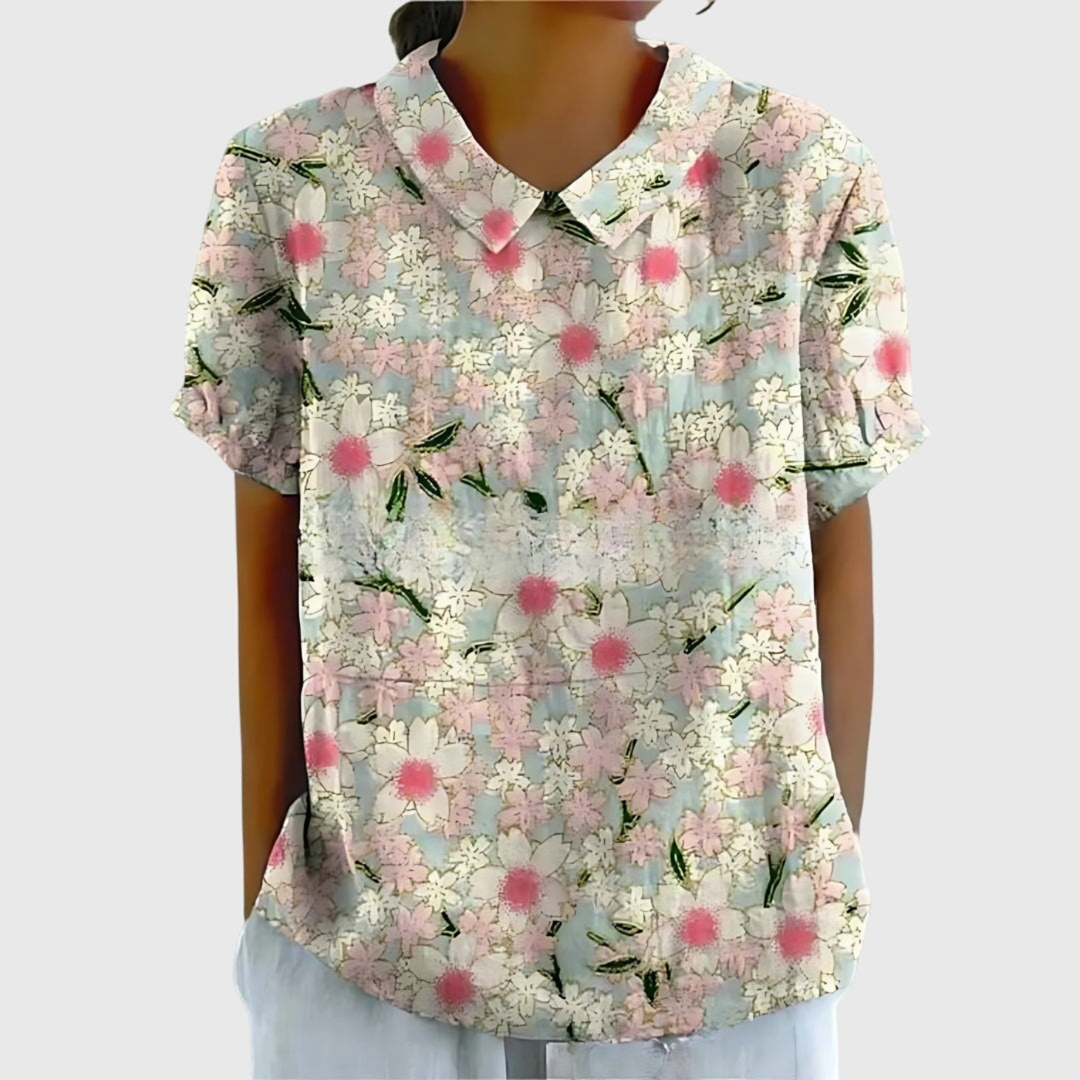 Stylish women's floral print blouse with collar, ideal for office chic or warm weather everyday style.