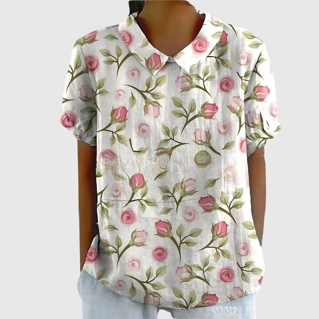Relaxed fit short-sleeve floral print blouse for women, featuring a classic collar and vibrant summer pattern.