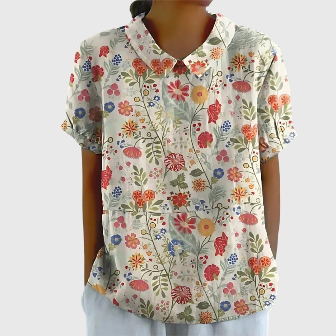 Comfortable relaxed fit women's floral print blouse, collared and short-sleeved for effortless summer style.