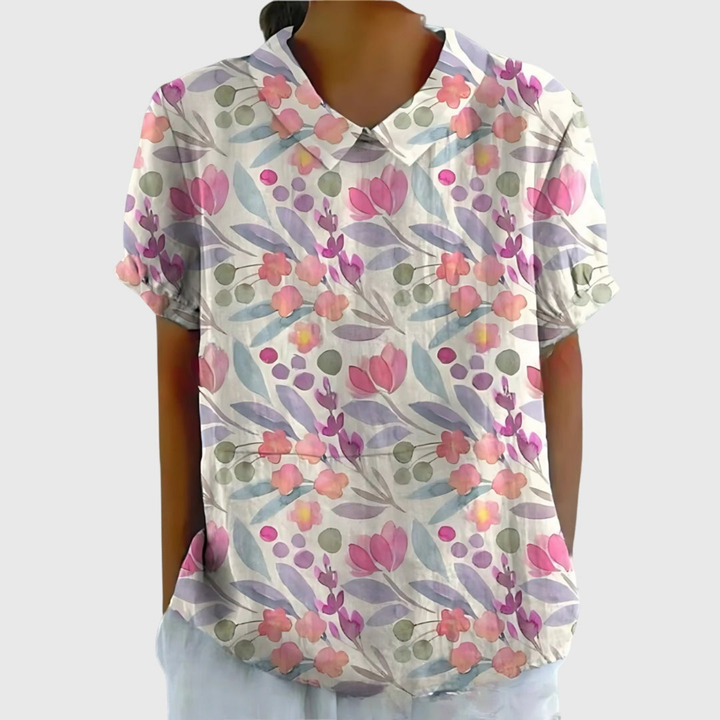 Chic floral print collared blouse for women, short sleeves, a vibrant print top for everyday fashion.