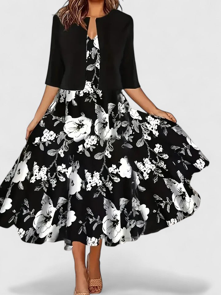 Chic women's party midi dress: floral print, colorblock A-line cut, three-quarter sleeves. Perfect occasion wear.