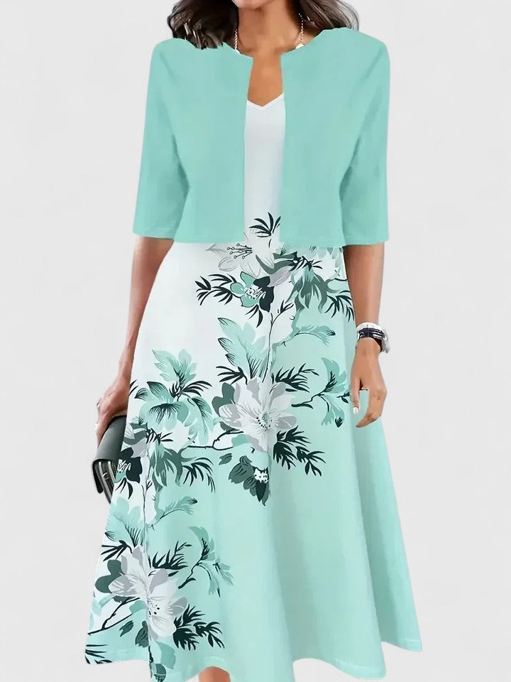 Women's stylish notch neck midi dress. Features beautiful floral print, modern colorblock panels & flowy design.