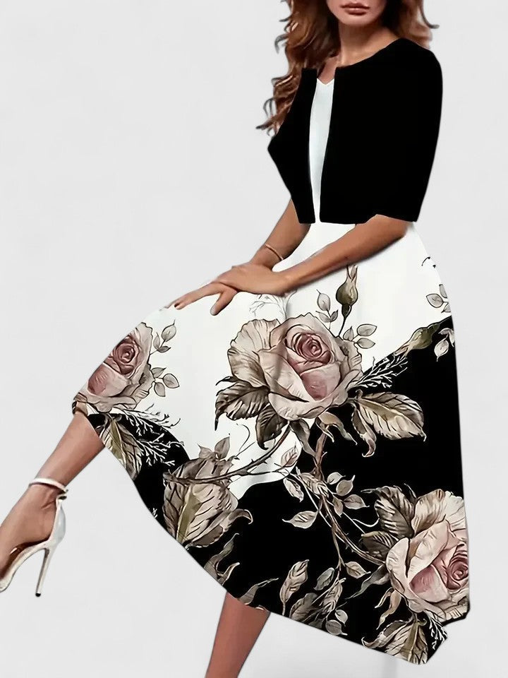 Versatile women's occasion midi dress: floral print, colorblock, A-line silhouette, three-quarter sleeves.