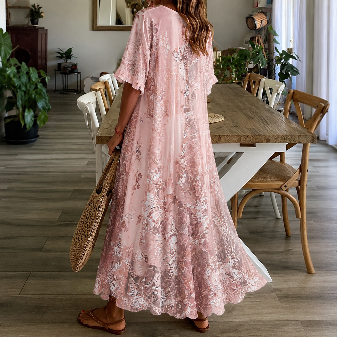 Flowy pink floral print maxi dress for women, ideal for a garden party, vacation, or summer day wear.