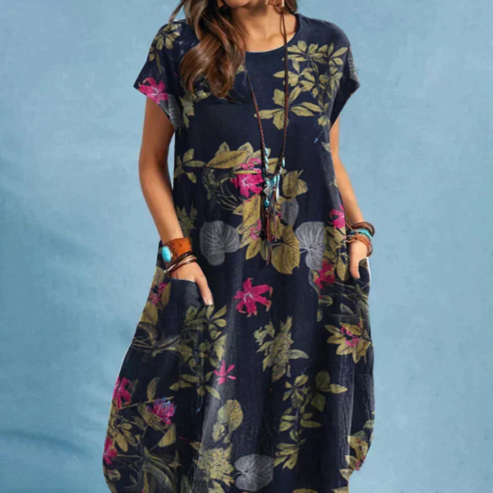 Women's floral print midi dress with short sleeves & practical pockets for comfortable everyday summer wear.
