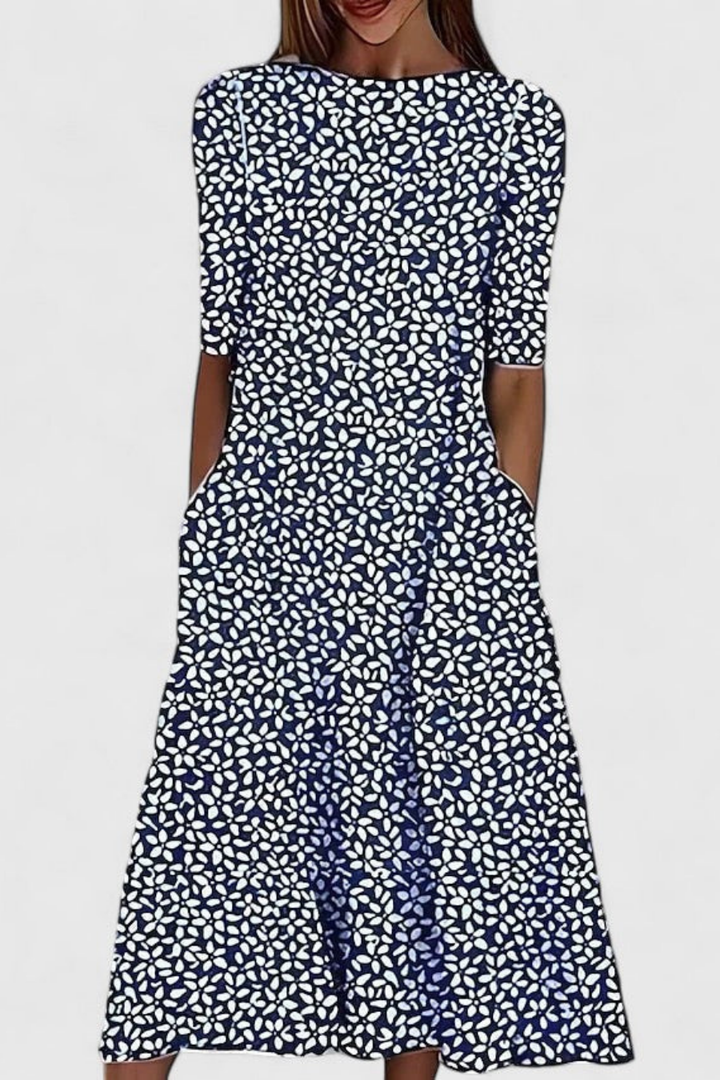 Comfortable women's floral midi dress with pockets & a relaxed fit, perfect for everyday wear or a stylish vacation outfit.