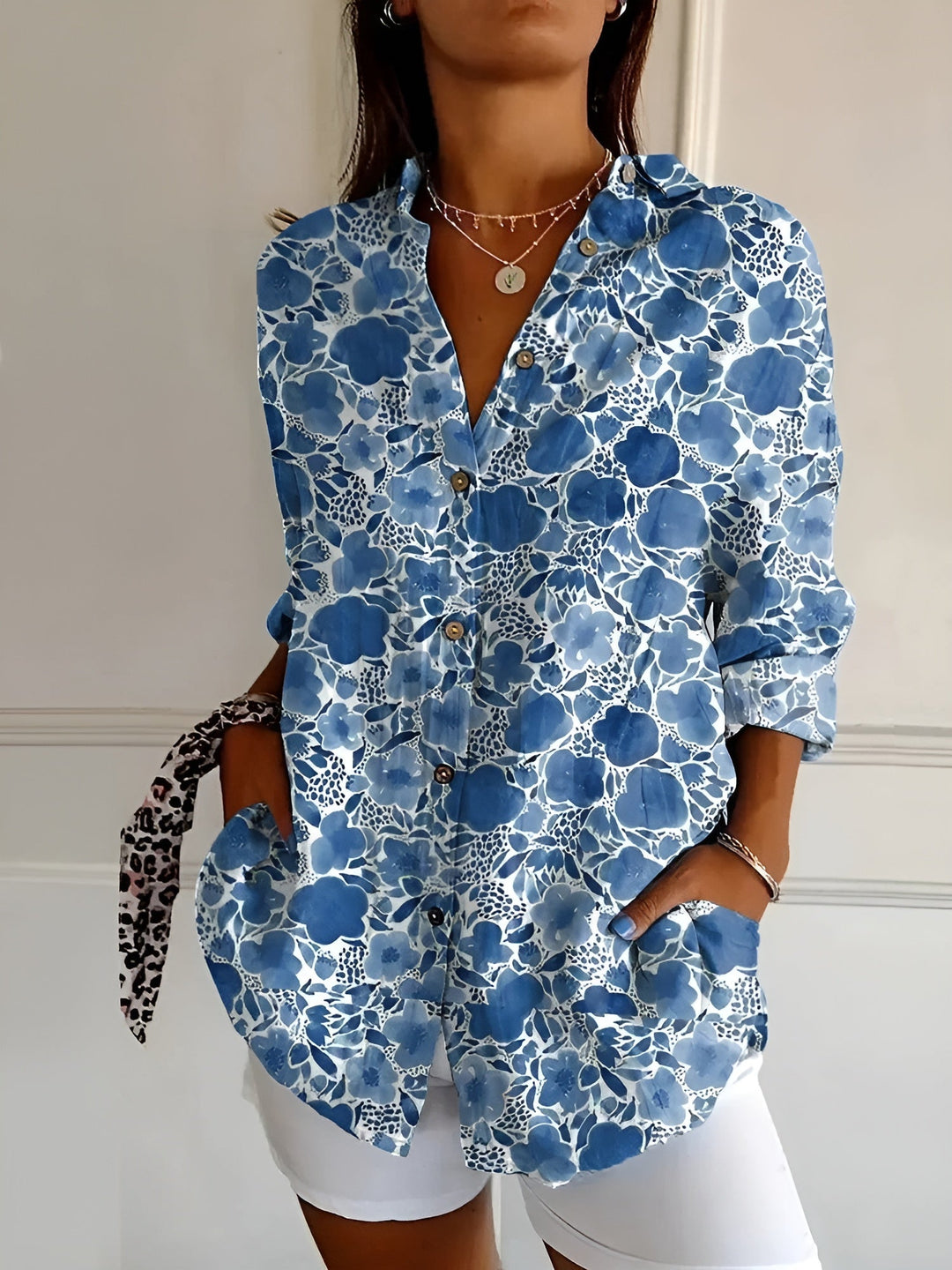 Women's floral print oversized button-down blouse, perfect for summer casual wear and relaxed style.