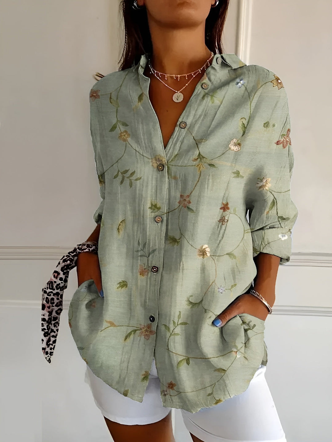Versatile women's floral print oversized button-down shirt, great for casual summer outfits or layered looks.